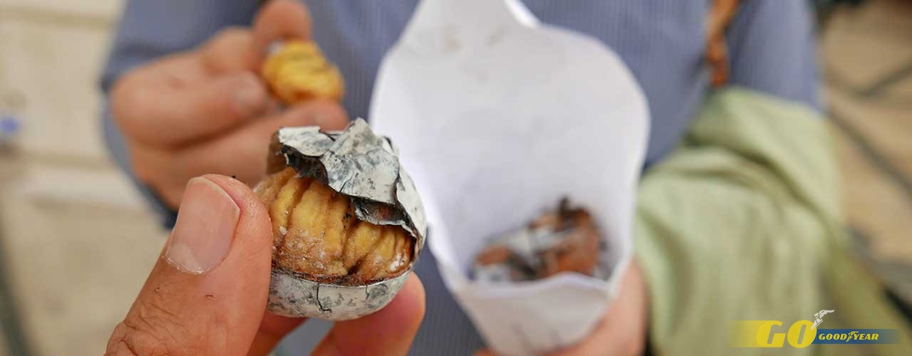 Typical street food in Lisbon Portugal,roasted chestnut castanhas assadas